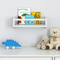 Children's room shelf with books, plush teddy bears, and blue dinosaur toy for nursery decor.