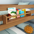 Wooden bunk bed bookshelf holding children's picture and board books (dinosaur and vehicles), striped blue-and-white bedding and smiling sun plush — kids' bedroom storage and nursery decor