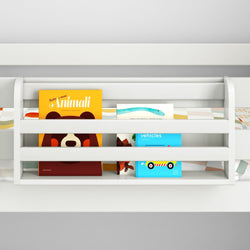 Children's book display with colorful covers on a white bookshelf.