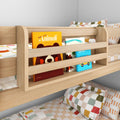 Modern light-wood kids' bunk bed with built-in book rack holding colorful children's books, patterned pillows and playful bedding