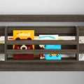 Bunk bed bookshelf with dark wood built-in book rail holding colorful children's board books (animals, vehicles) — kids bedroom storage organizer