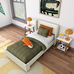 Kids bedroom with a green striped bedspread, orange accents, and modern decor.