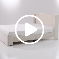 Beige upholstered platform bed with padded headboard and white mattress, minimalist modern bedroom furniture