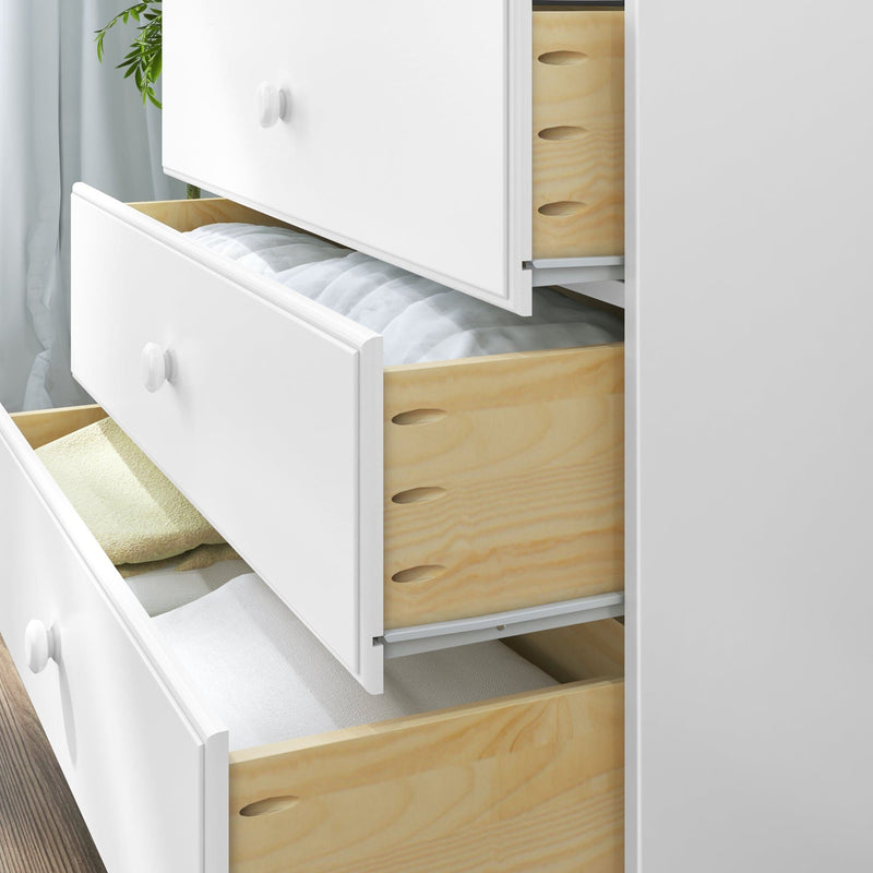 White wooden dresser with open drawers showing folded linens and towels, modern bedroom storage and organization