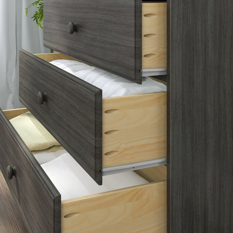 Dark gray wood dresser with open drawers showing light plywood dovetail joints and folded linens, modern bedroom storage