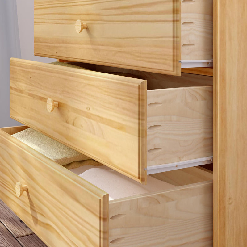 Wooden dresser with open drawers containing neatly folded clothes.