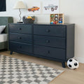 Dark navy six-drawer dresser in modern kids' bedroom with lamp, toy basket, wooden car cubby, framed car prints and soccer ball