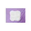 Folded white pillowcase with unique design and cross pattern on purple background.