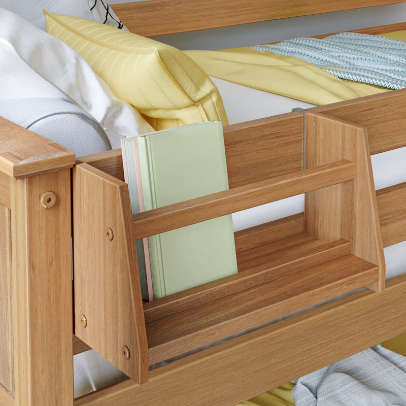 Oak wooden bed frame with built-in bedside bookshelf holding pastel hardcover books, yellow pillow and cozy yellow and blue bedding