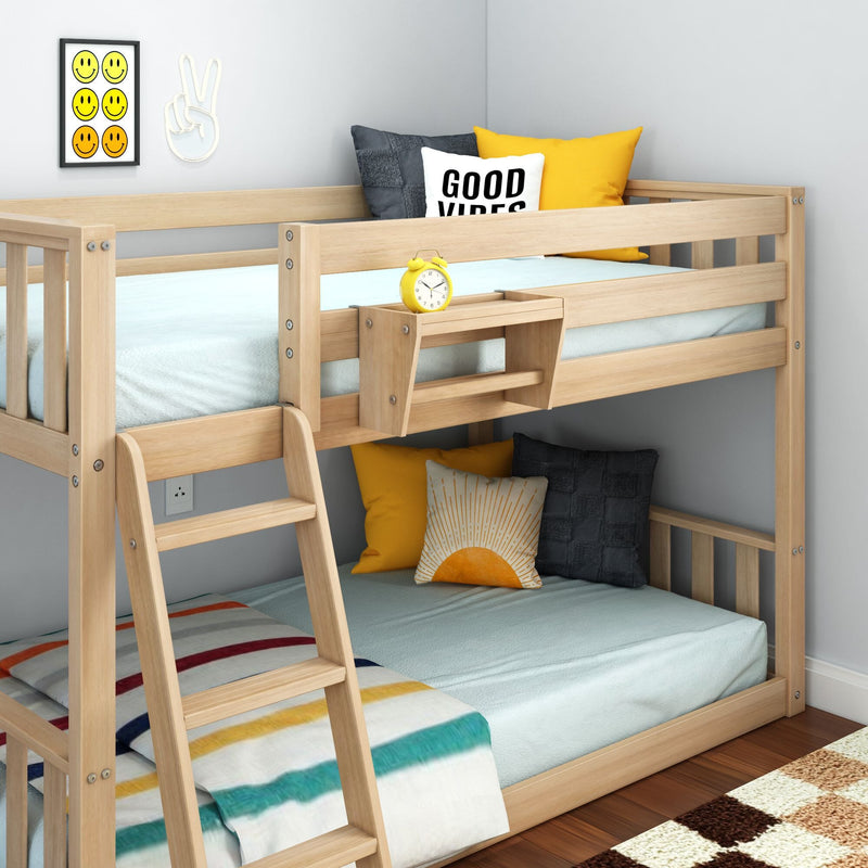 Solid pine twin-over-full bunk bed with ladder and built-in shelf, natural wood finish, light-blue bedding, yellow accent pillows and "Good Vibes" throw pillow in modern kids bedroom with smiley wall art