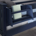 Navy blue wooden twin bunk bed with built-in side bookshelf holding books, ladder and gray bedding for a kids' bedroom