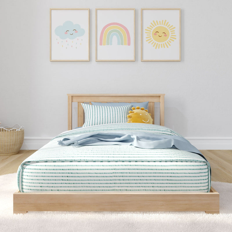 Minimalist kids bedroom with wooden bed, striped bedding, and playful wall art featuring clouds, rainbow, and sun.