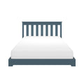 Blue wooden slatted twin bed frame with white mattress on a minimalist platform — modern single bed headboard close-up