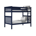 Navy blue twin-over-twin wooden bunk bed with ladder, slatted guardrails, white pillows and gray throw