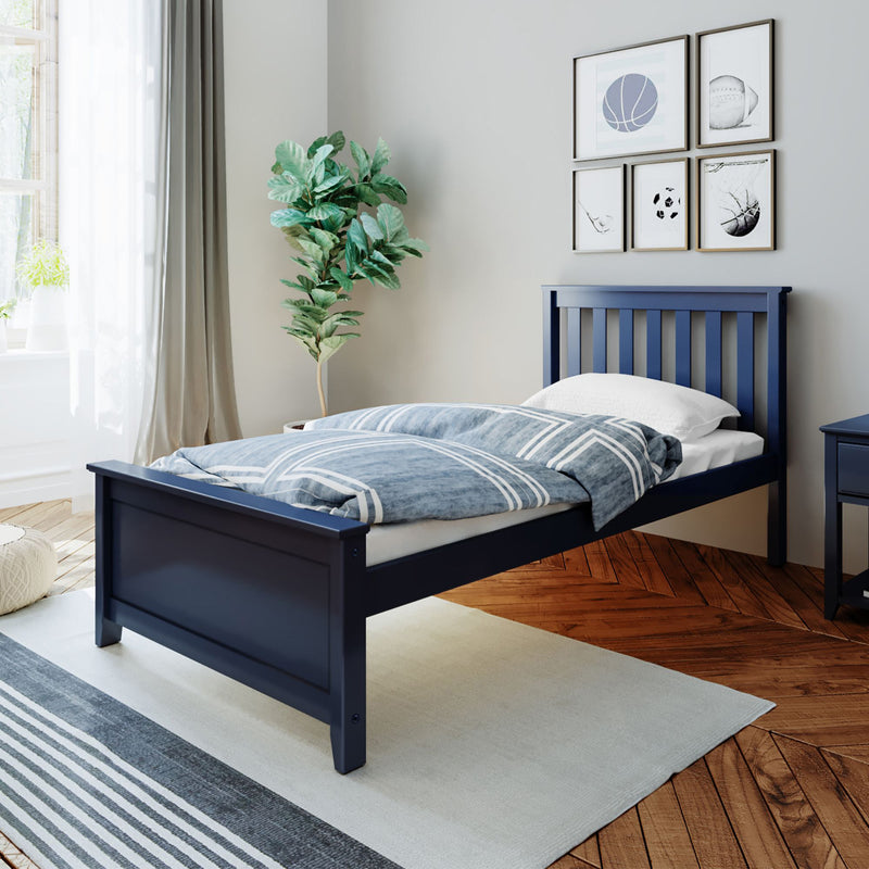 Navy blue wooden single bed in a modern bedroom with blue striped bedding, indoor plant, and framed wall art.