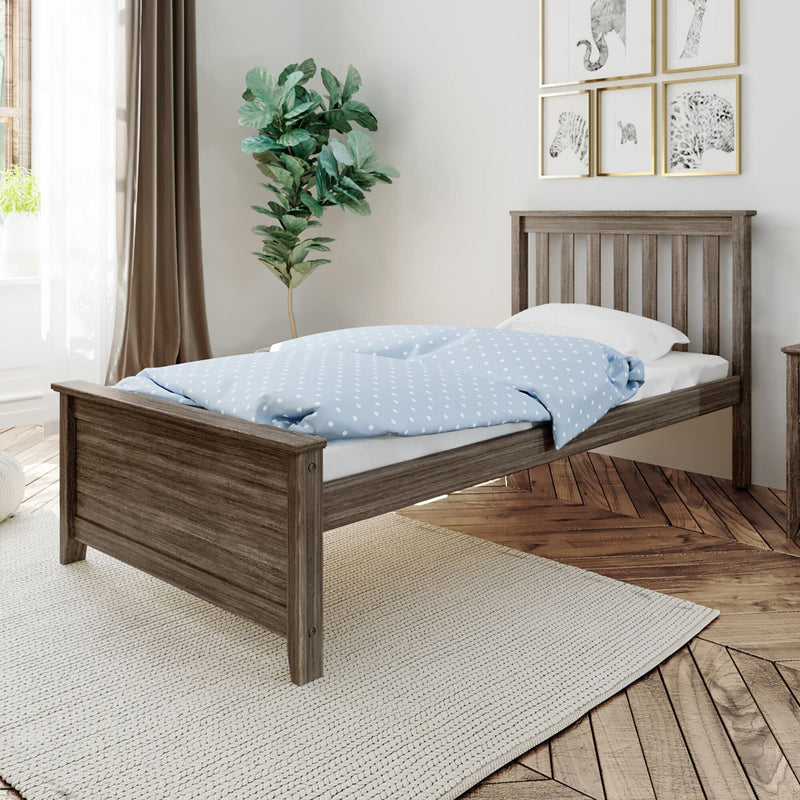 Rustic gray wood twin bed frame with slatted headboard and blue polka-dot duvet in bright modern farmhouse bedroom with fiddle leaf fig, hardwood floors and neutral rug