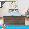 Gray solid New Zealand pine twin bed frame with slatted headboard and footboard in modern bedroom, blue polka-dot duvet, matching nightstand, plywood slats and 400 lb support bar