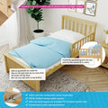 Solid New Zealand pine toddler bed with blue polka-dot bedding and removable safety guardrail, easy-to-install add-on bedrail for kids' beds
