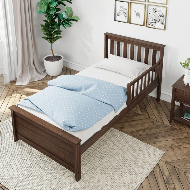 Wooden twin bed with light blue polka-dot duvet in a minimalist kids' bedroom featuring a potted fiddle leaf fig, framed animal art, parquet floor and neutral curtains
