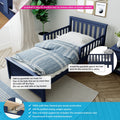 Navy blue solid New Zealand pine toddler bed with removable guardrail, easy-install add-on rails, fits standard mattress