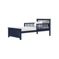 Navy blue wooden twin bed frame with slatted headboard and side rails, white mattress and gray patterned pillows—modern single bed for kids and teens