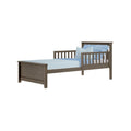 Gray-brown wooden twin bed frame with slatted side rails, headboard and footboard, styled with light blue sheets and pillows