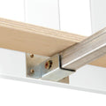 Close-up of plywood shelf edge and metal bracket hardware for floating shelf support, showing layered plywood and screw fasteners.