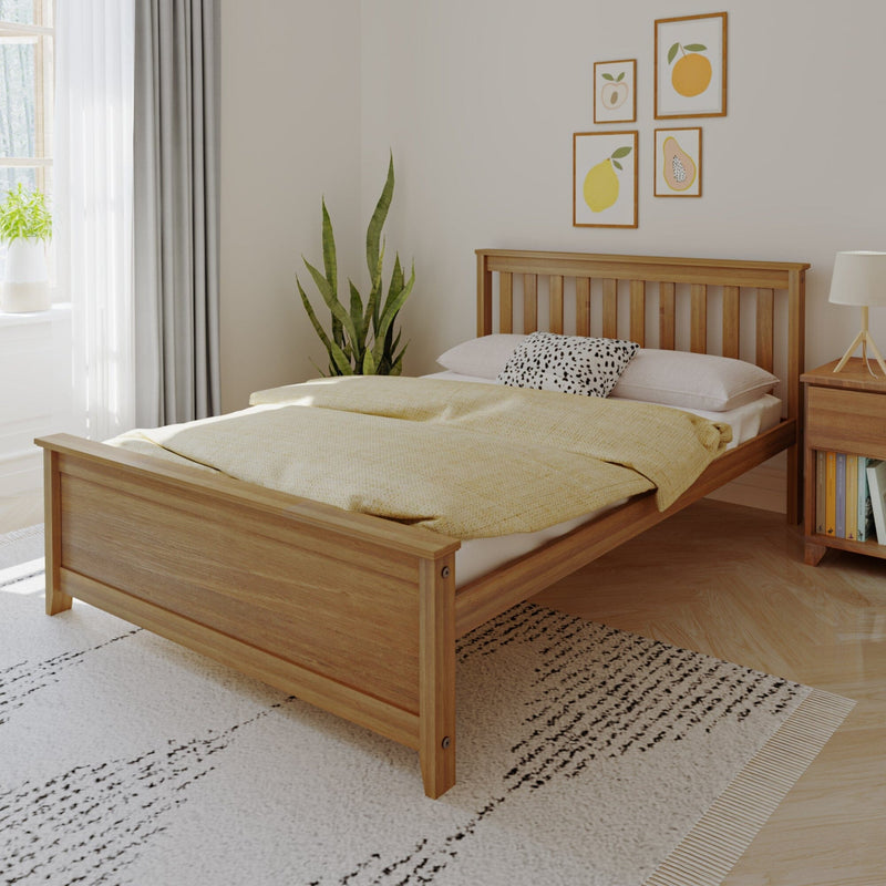 Minimalist modern bedroom with solid wood bed frame, yellow duvet, black-and-white accent pillow, snake plant, citrus framed wall art and natural light