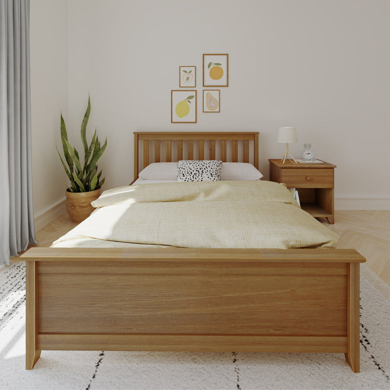 Minimalist Scandinavian bedroom with wooden bed frame, neutral bedding, fruit wall art, nightstand lamp and potted snake plant