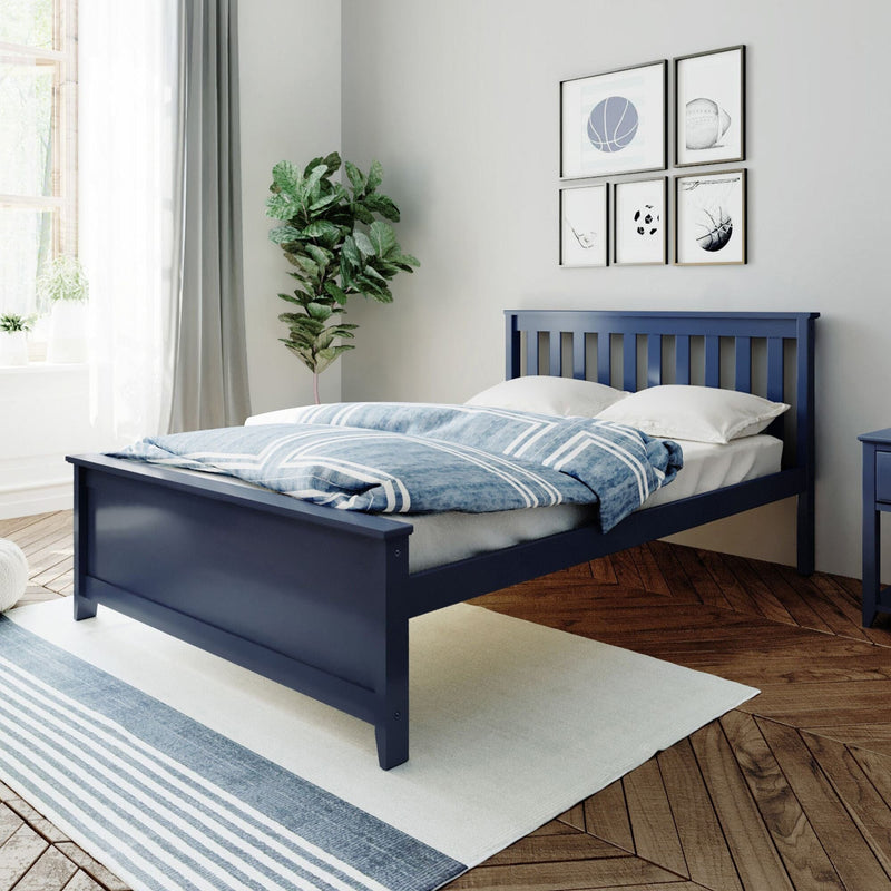 Blue wooden bed frame in a modern bedroom with white and blue bedding, houseplant, and framed sports art on the wall.