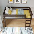 Overhead view of a dark wood toddler loft bed with yellow bedding, patterned pillows and ladder in a modern kids bedroom with framed animal prints and a striped rug