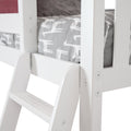 Close-up of white wooden bunk bed ladder and guardrail with grey giraffe-print fitted sheet on child's mattress