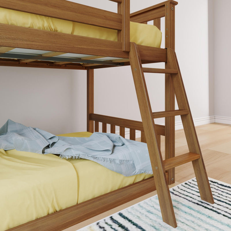 Wooden bunk bed with ladder, yellow bedding, and blue blanket on lower bunk in a bright room with hardwood floor.