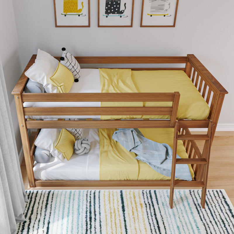 Wooden bunk bed with yellow bedding in a modern kid's room featuring striped rug and framed animal art.
