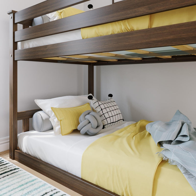 Wooden bunk bed lower bunk with yellow bedding, white sheets, checkered and knot decorative pillows and light blue throw in kids' bedroom