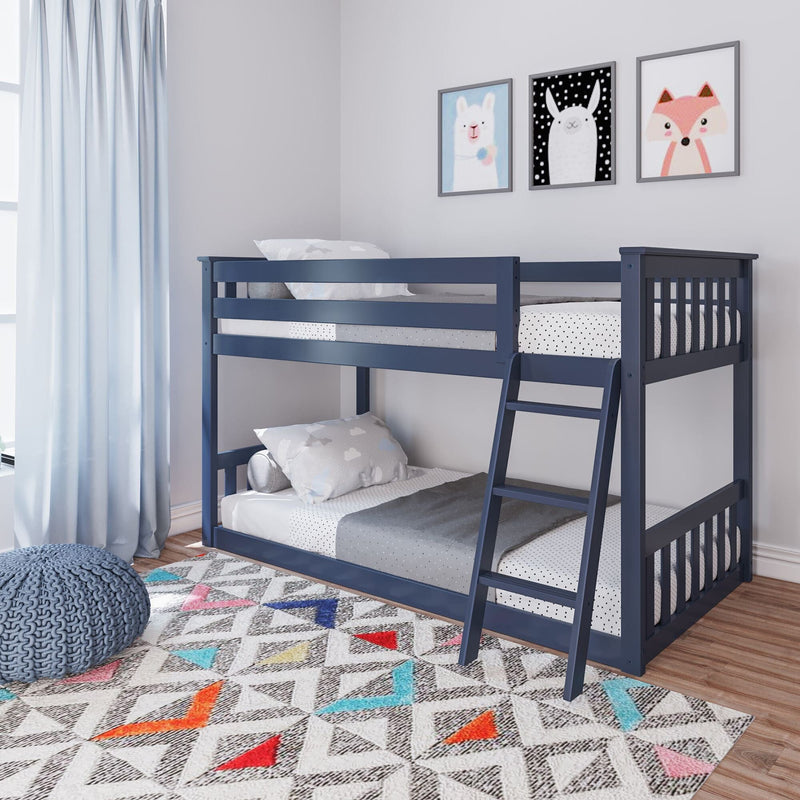 Blue wooden bunk bed in a modern children's room with colorful geometric rug and playful animal art on the wall.