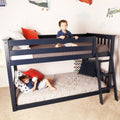 Two smiling boys on a navy blue twin-over-full bunk bed in a kids' bedroom with airplane wall decals