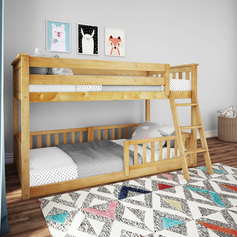 Wooden bunk bed in children's room with colorful rug and animal-themed wall art.