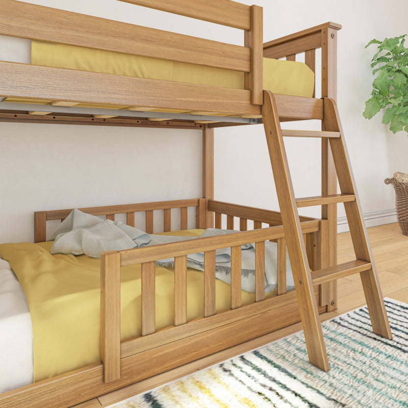 Solid wood bunk bed with built-in ladder and yellow bedding in a modern kids' bedroom with striped rug and potted plant