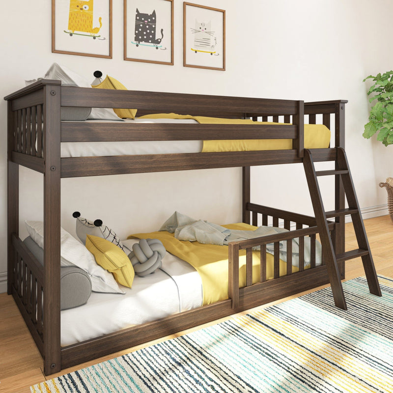 Wooden bunk bed with yellow bedding in a modern children's room featuring playful wall art and a colorful striped rug.