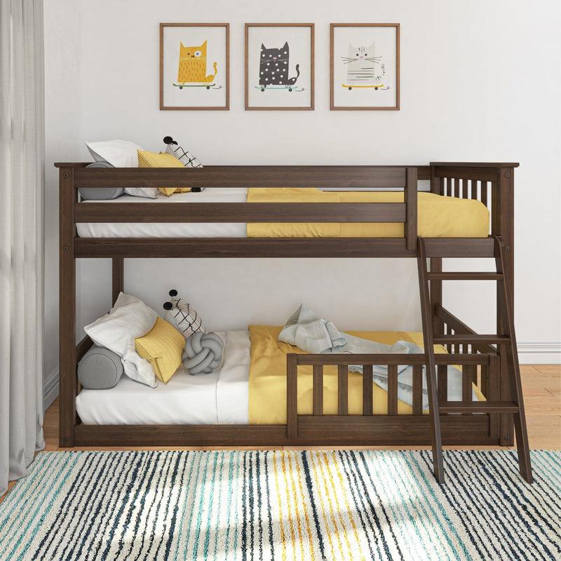 Wooden bunk bed with yellow and white bedding in a cozy children's room with cat-themed wall art.