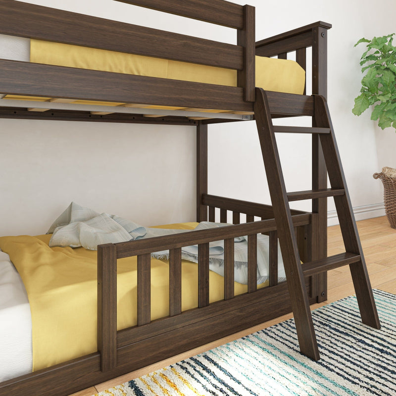 Wooden bunk bed with yellow bedding and a cozy blanket in a bright room.