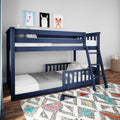Navy blue wooden twin-over-twin bunk bed for kids with ladder in a decorated children's bedroom, polka-dot bedding, colorful geometric rug and framed animal wall art