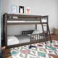 Modern gray wooden twin-over-twin bunk bed with ladder in kids' bedroom, polka-dot bedding, animal wall art and colorful geometric rug