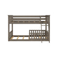 Gray wooden twin-over-twin bunk bed with built-in ladder, slatted guardrails, exposed mattress slats, rustic gray finish