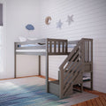 Gray wooden kids loft bunk bed with staircase, white shiplap accent wall featuring moon and star decor, blue striped bedding and rug