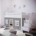 White wooden kids loft bed with stairs and gray playhouse curtain, geometric rug, star and moon wall decor in nursery