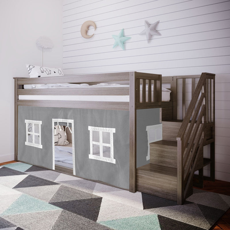 Grey wooden kids loft bed with built-in staircase and playhouse curtain, modern toddler bunk bed in nursery with geometric rug and star-and-moon wall decor