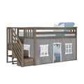 Gray wood twin loft bed with staircase and storage steps, safety rails and gray playhouse tent cover for kids' bedroom