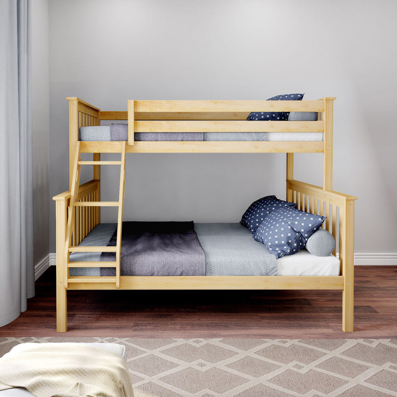 Light natural wood bunk bed with ladder in modern children's bedroom, navy star-pattern pillows, gray bedding, hardwood floor and neutral geometric rug